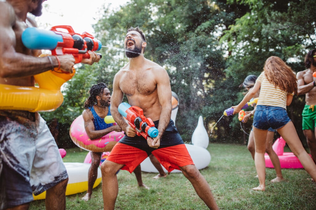 A group of friends in a water gun fight