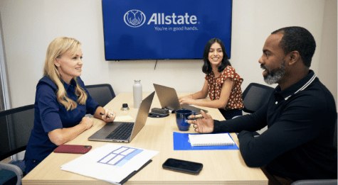 two women and a man at Allstate attending a meeting