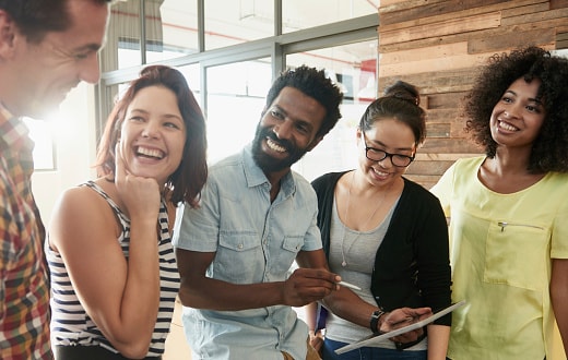 group of young people chatting in an office