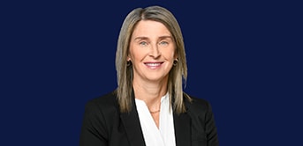 a headshot of Jennifer Power in a black suit