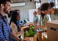 group of volunteers packing boxes